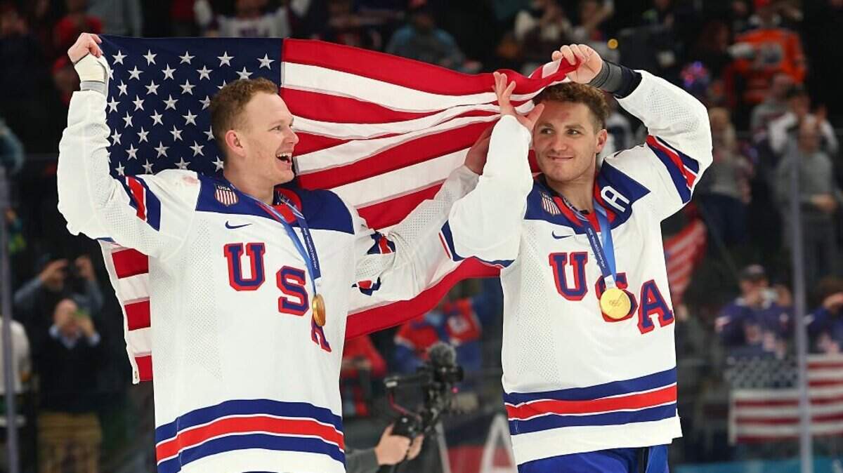 MILAN, ITALY: Gold medalists Brady Tkachuk #7 and Matthew Tkachuk #19 of Team USA celebrates after the medal ceremony for men's ice hockey following a 2-1 overtime victory over rival Canada on the final day of the 2026 Winter Olympics at Milano Santagiulia Ice Hockey Arena on February 22, 2026 in Milan, Italy. MILAN, ITALY - FEBRUARY 22: Gold medalists Brady Tkachuk #7 and Matthew Tkachuk #19 of Team United States celebrates after the medal ceremony for Men's Ice Hockey following the Men's Gold Medal match between Canada and the United States on day 16 of the Milano Cortina 2026 Winter Olympic games at Milano Santagiulia Ice Hockey Arena on February 22, 2026 in Milan, Italy. (Photo by Gregory Shamus/Getty Images)